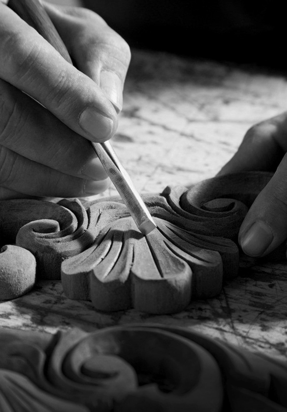 Hands carving timber